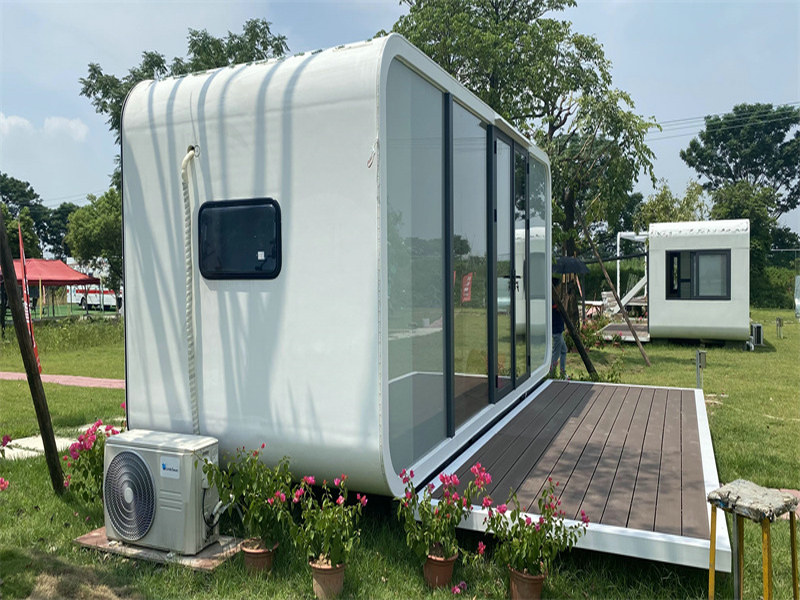 Convertible container housing conversions with folding furniture