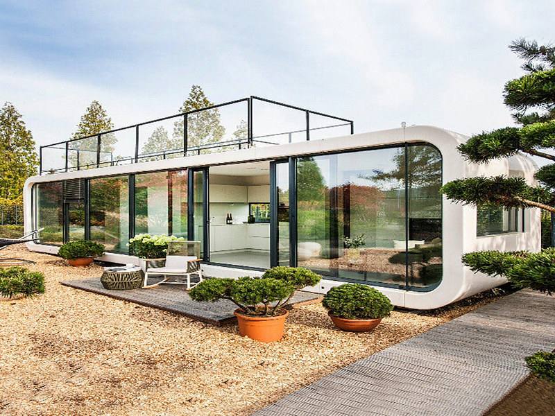 Eco-friendly modern prefab glass house systems with Japanese-style interiors